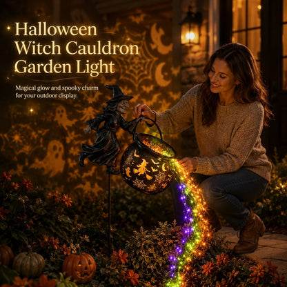 Halloween witch cauldron garden light glowing at night with cascading rainbow stream