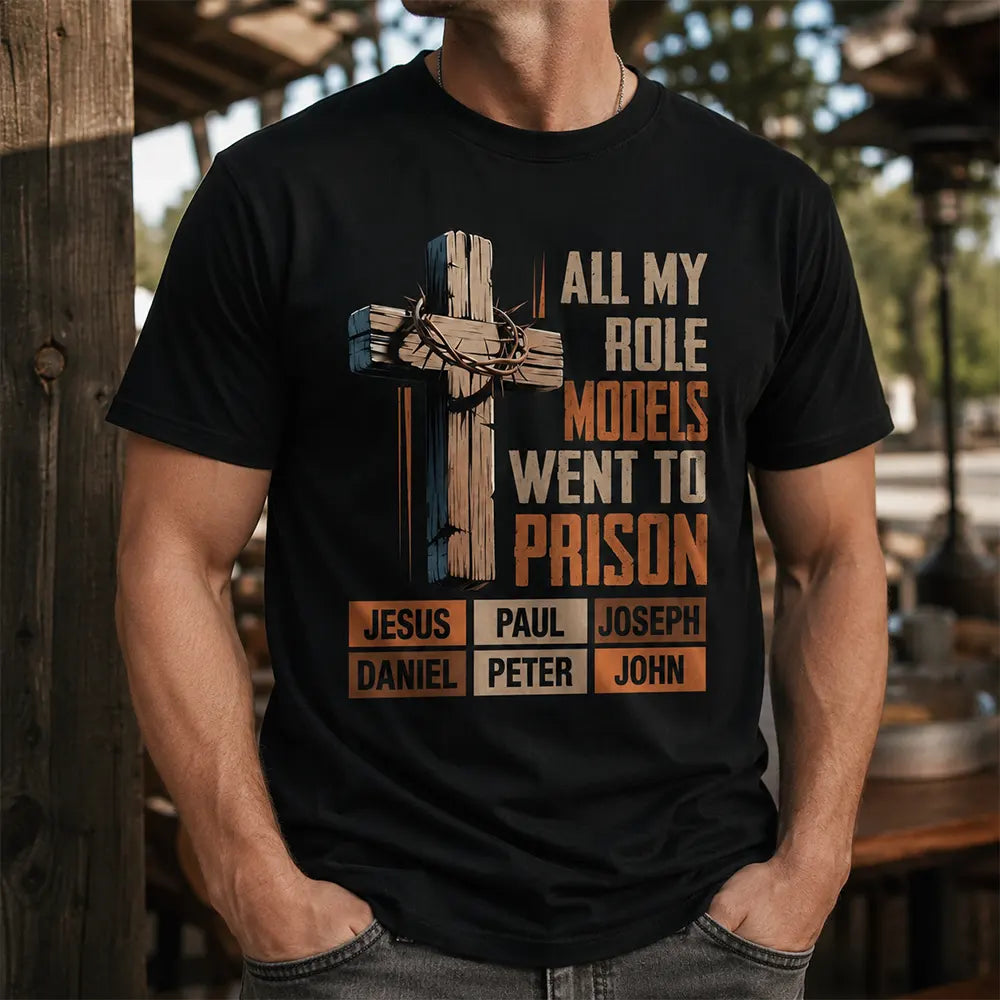 Man wearing black All My Role Models Went To Prison Christian cross T-shirt outdoors