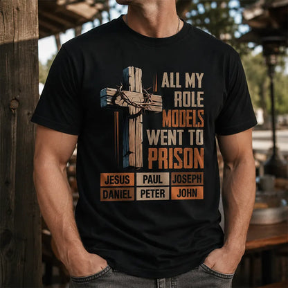 Man wearing black All My Role Models Went To Prison Christian cross T-shirt outdoors