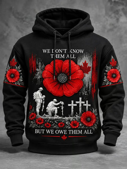 Black Remembrance Day hoodie with red poppies, maple leaves, soldier figures and memorial crosses