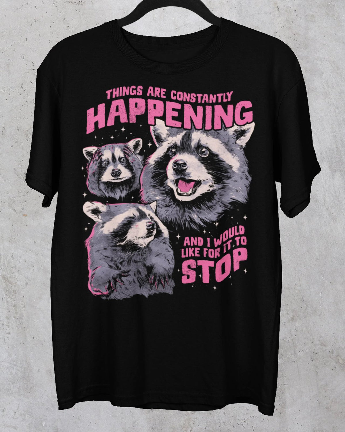 Black Things Are Constantly Happening raccoon graphic tee with pink slogan lettering