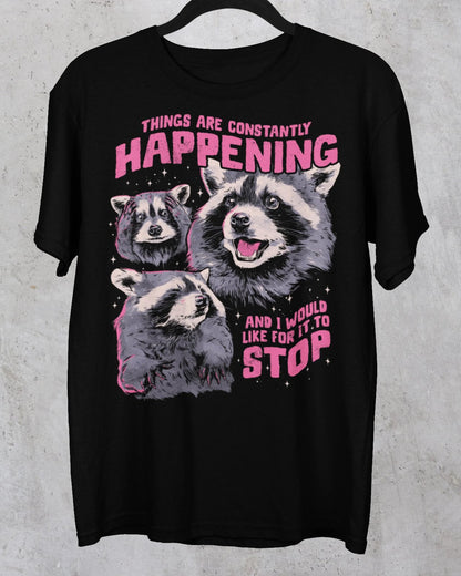 Black Things Are Constantly Happening raccoon graphic tee with pink slogan lettering