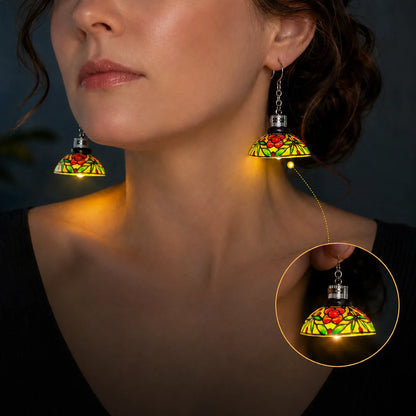 Vintage light-up chandelier earrings glowing on model at night