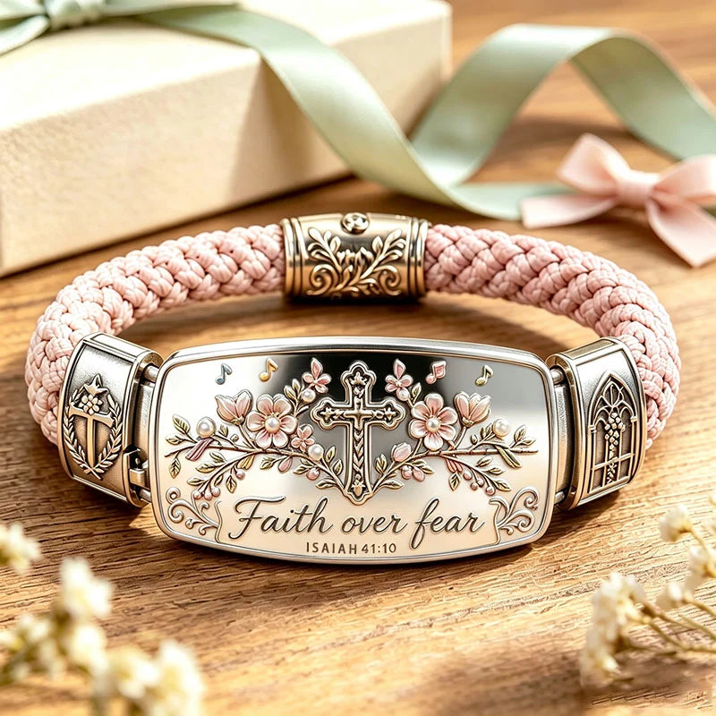 Faith Over Fear bracelet close-up showing polished cross and cherry blossom design