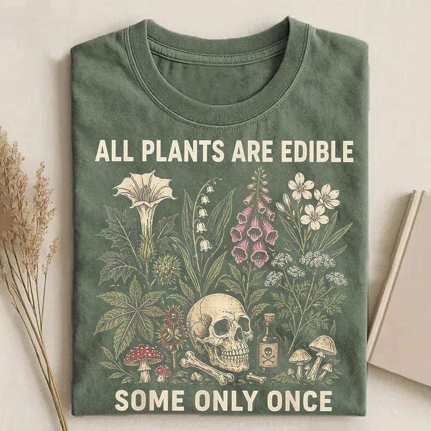 All Plants Are Edible botanical skull T-shirt sage green with mushrooms and wildflower illustration