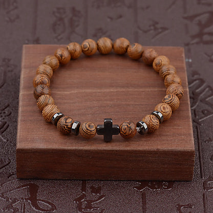 Cross wooden bead bracelet on dark wood gift box