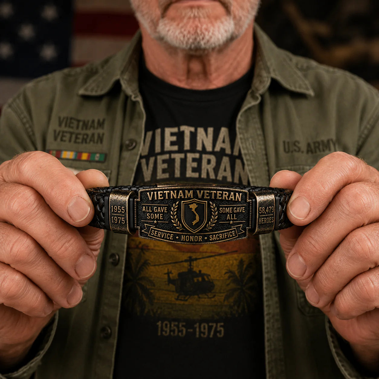Veteran holding Vietnam Veteran Honor Bracelet with US Army flag