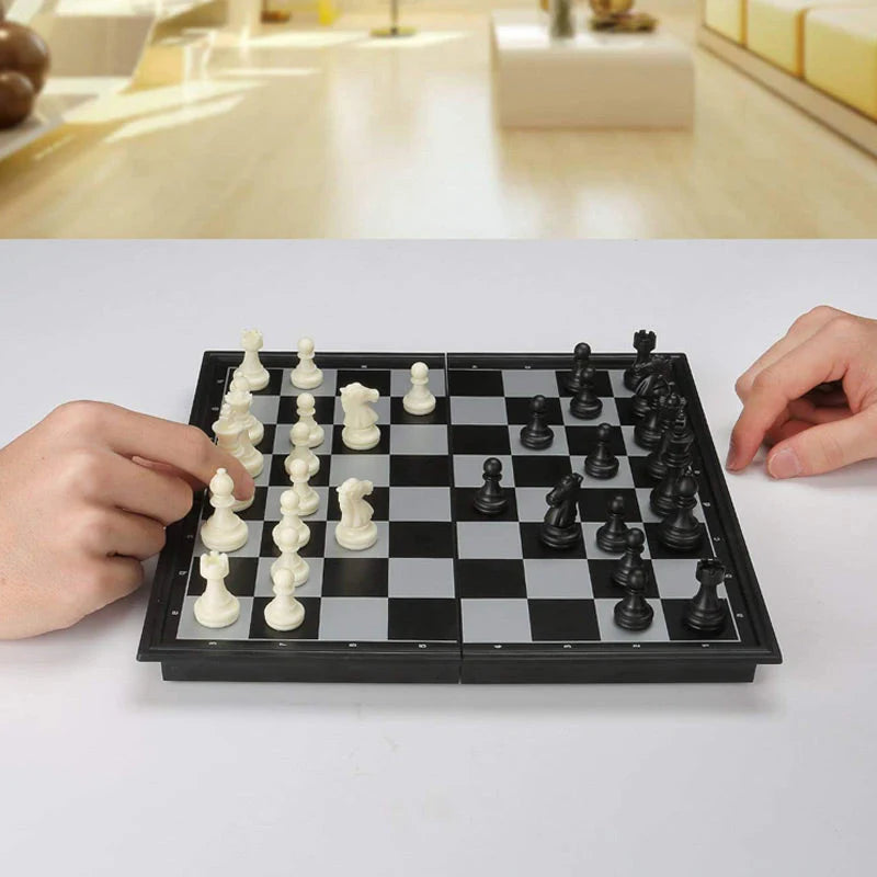Close-up of hand moving a chess piece during a game