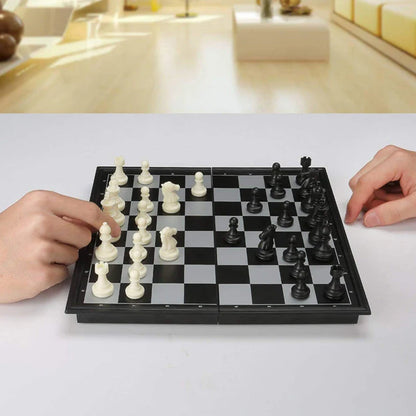 Close-up of hand moving a chess piece during a game