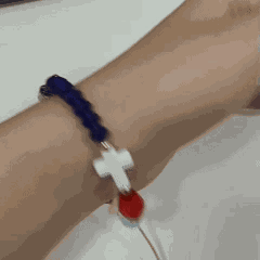 Real person wearing the Story of Jesus faith bracelet on wrist