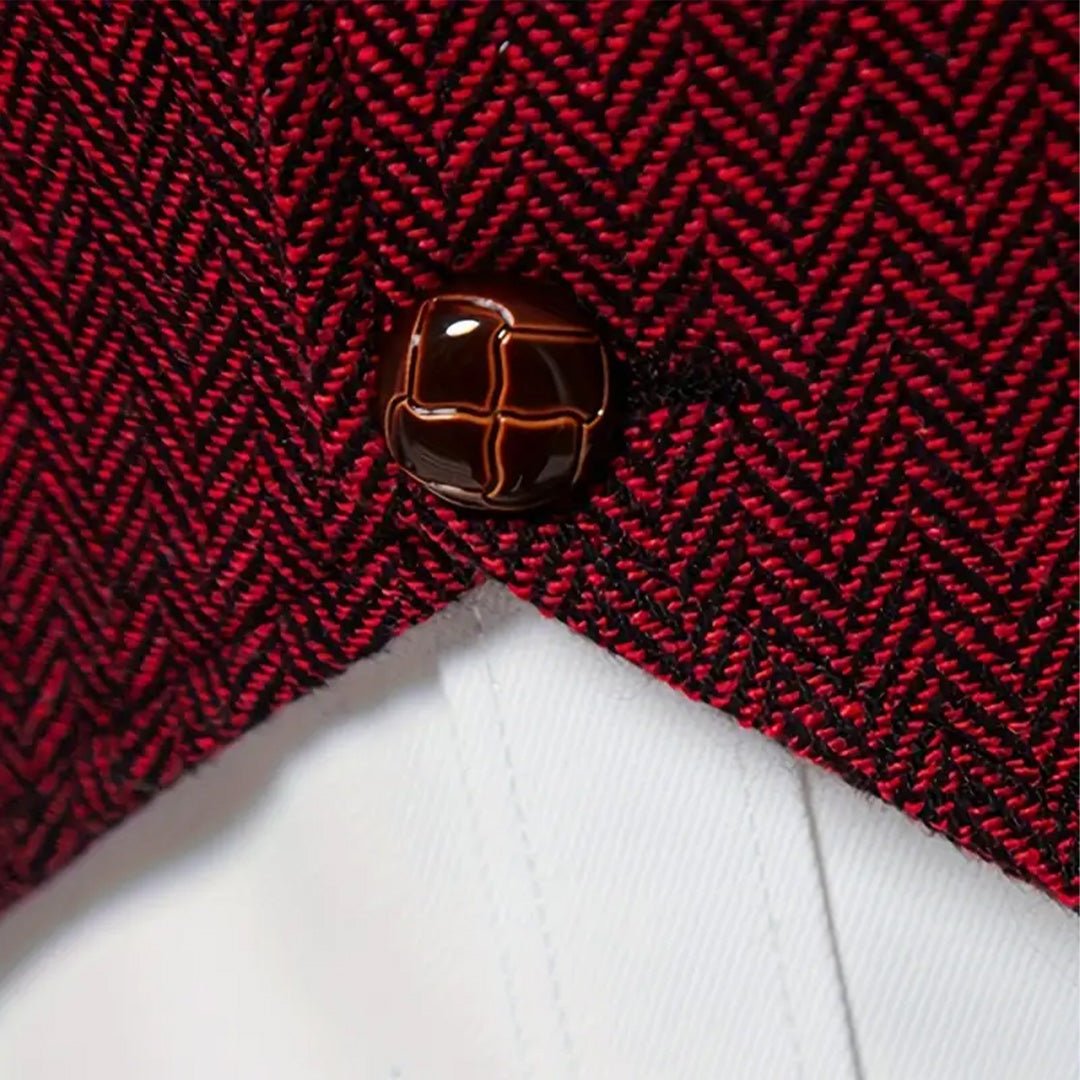Copper-look buttons and gold chain close-up on herringbone waistcoat