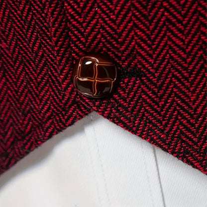 Copper-look buttons and gold chain close-up on herringbone waistcoat