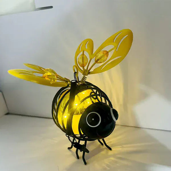 Solar bee lantern in outdoor garden patio setting