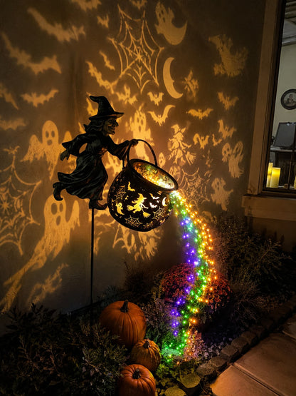 Halloween witch cauldron light projection on indoor wall