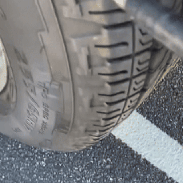 Sealed tire driving smoothly on the road after repair