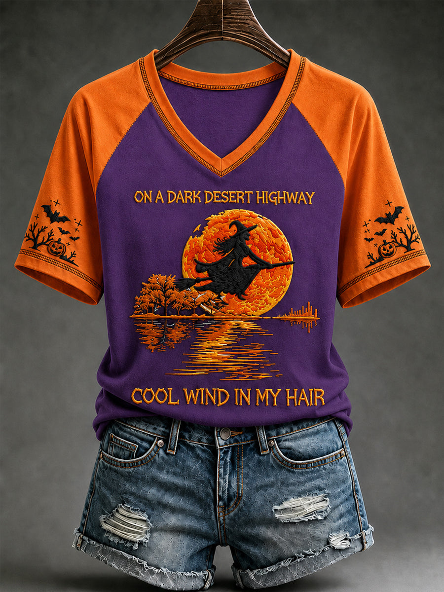 Women's Halloween witch pumpkin V-neck tee in light purple with orange sleeves