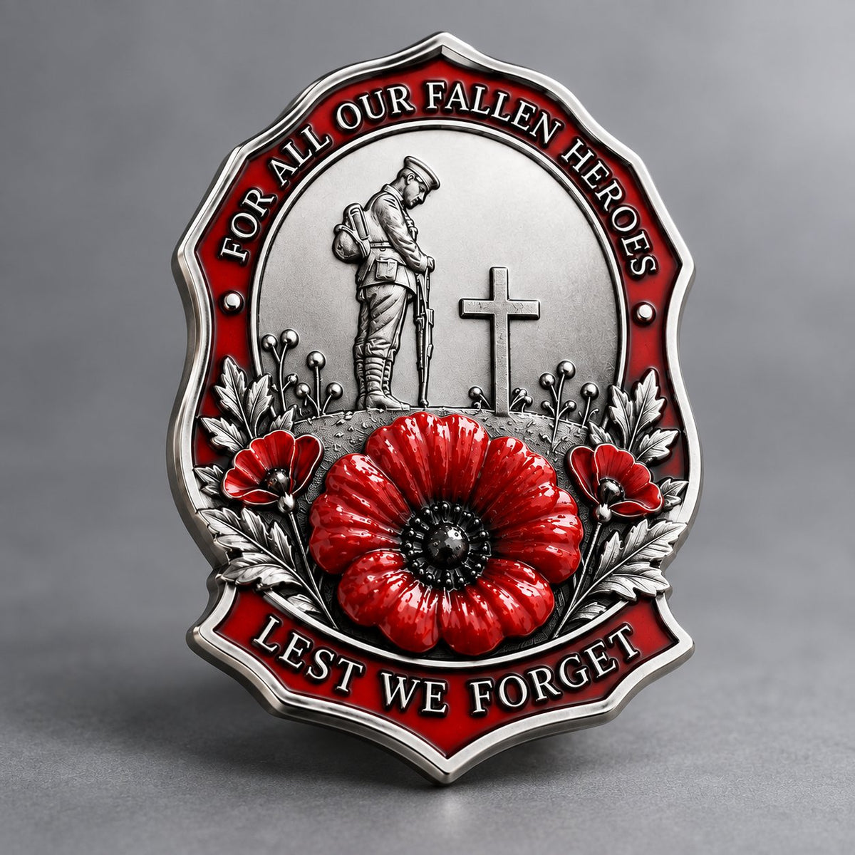 Silver-tone red poppy remembrance brooch with Lest We Forget message
