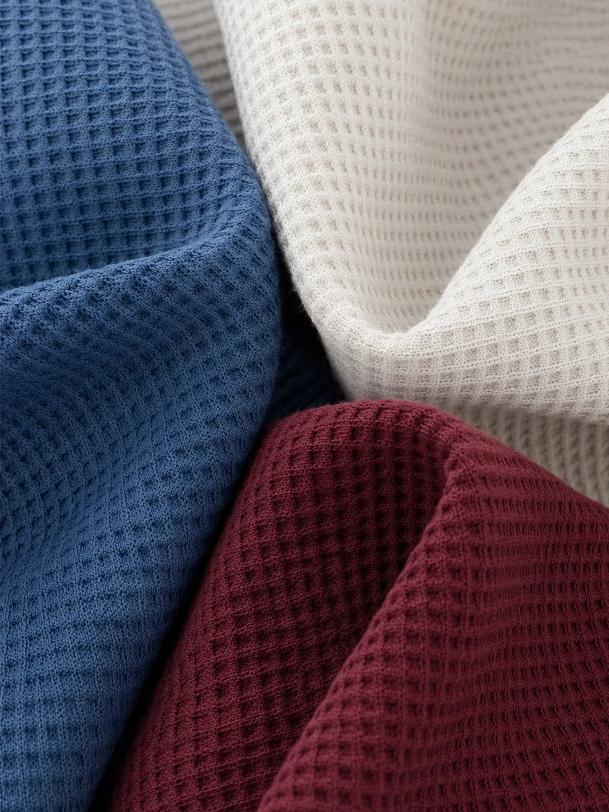 Blue white and burgundy waffle knit texture close-up