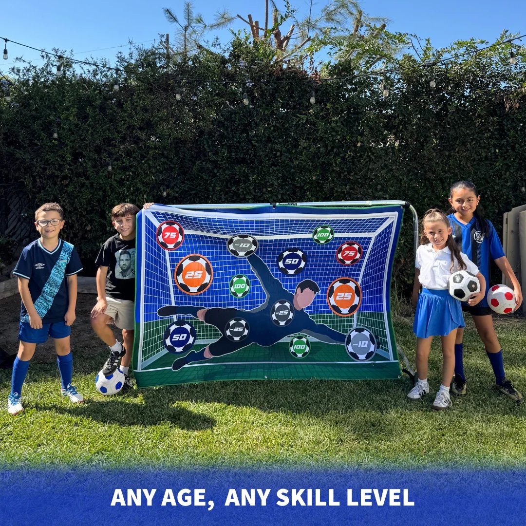 Kids holding a soccer target mat in a backyard