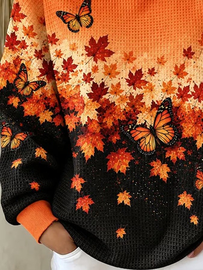Autumn leaf and butterfly sweatshirt orange cuff and lower print detail