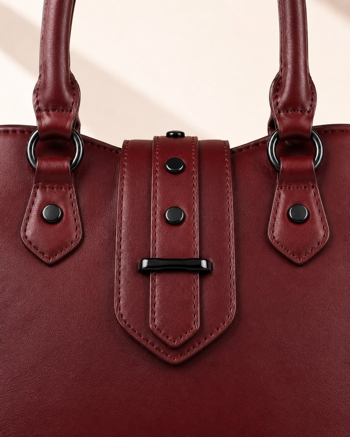 Dark Cherry vegan leather batwing tote texture and metal hardware close-up