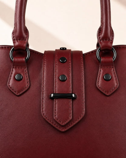 Dark Cherry vegan leather batwing tote texture and metal hardware close-up