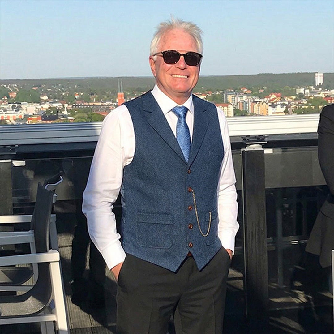 Man wearing herringbone tweed waistcoat outdoors in modern gentleman style