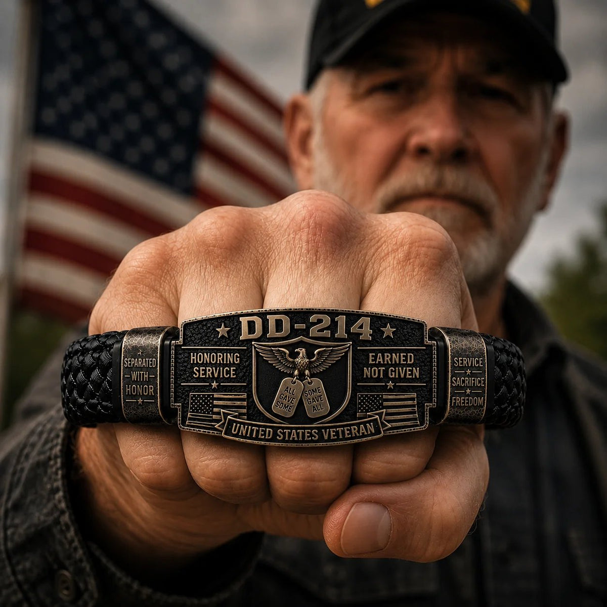 Veteran holding up wrist wearing DD-214 bracelet with American flag background