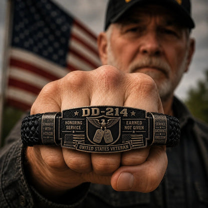 Veteran holding up wrist wearing DD-214 bracelet with American flag background