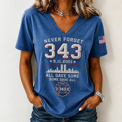 Woman wearing blue Never Forget 9/11 FDNY 343 memorial tribute v-neck t-shirt