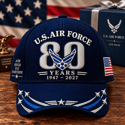 Air Force 80th Anniversary cap on wooden table with American flag and gift box