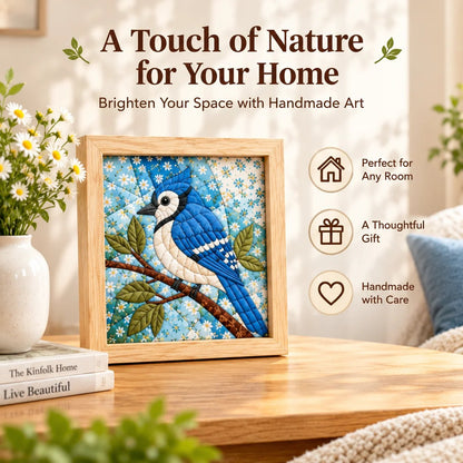 Blue Jay fabric art displayed on a desk beside books for a quiet home corner