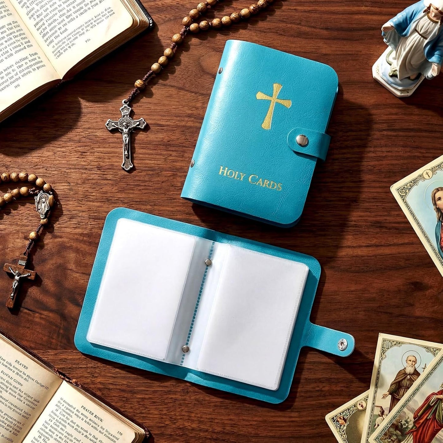 Blue Catholic holy card holder with rosary beads on prayer table