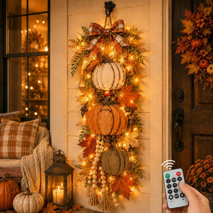 Hand holding remote control for warm LED wooden pumpkin door hanging