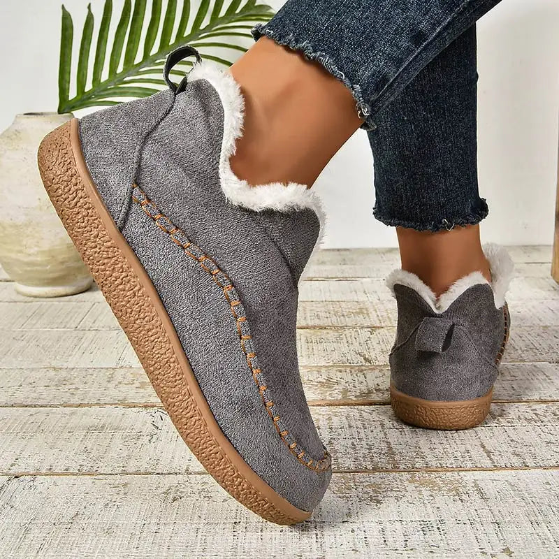 Gray women’s fleece-lined slip-on ankle boots with fluffy collar trim