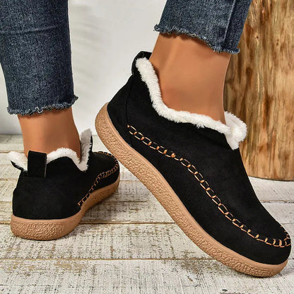 Black women’s fleece-lined slip-on ankle boots with contrast stitching
