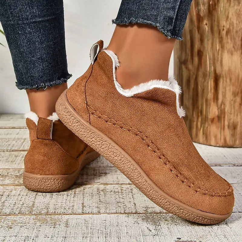 Brown women’s fleece-lined slip-on ankle boots with rear pull tabs