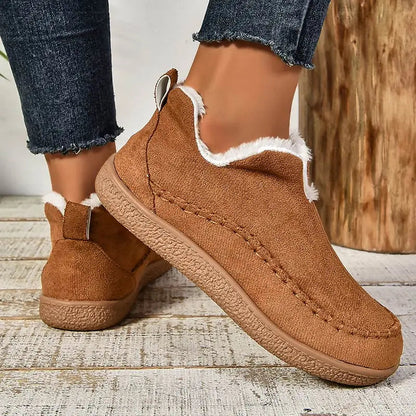 Brown women’s fleece-lined slip-on ankle boots with rear pull tabs