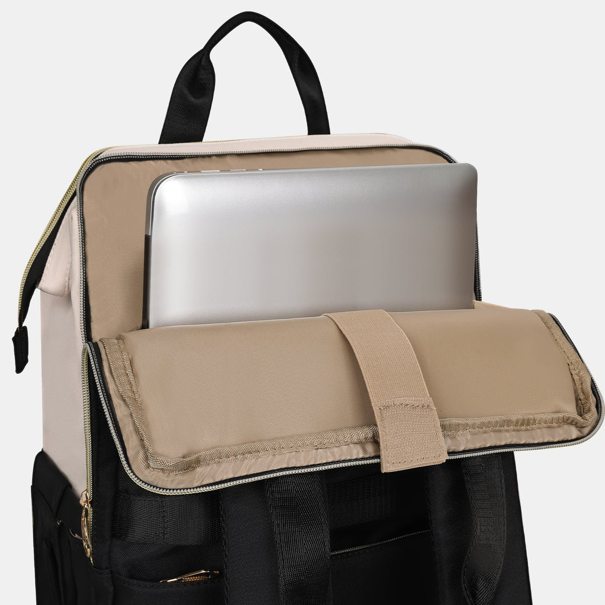 Laptop sliding into the padded sleeve of the lunch backpack