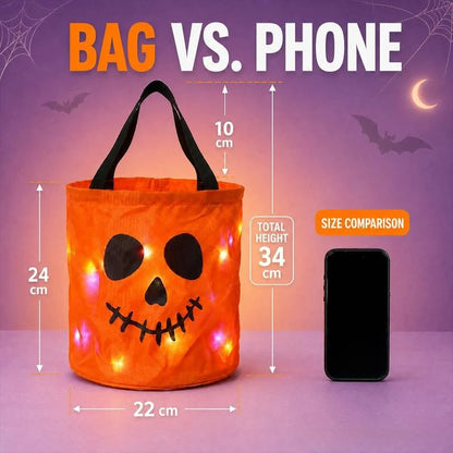 Orange LED Halloween treat bag size diagram beside a phone