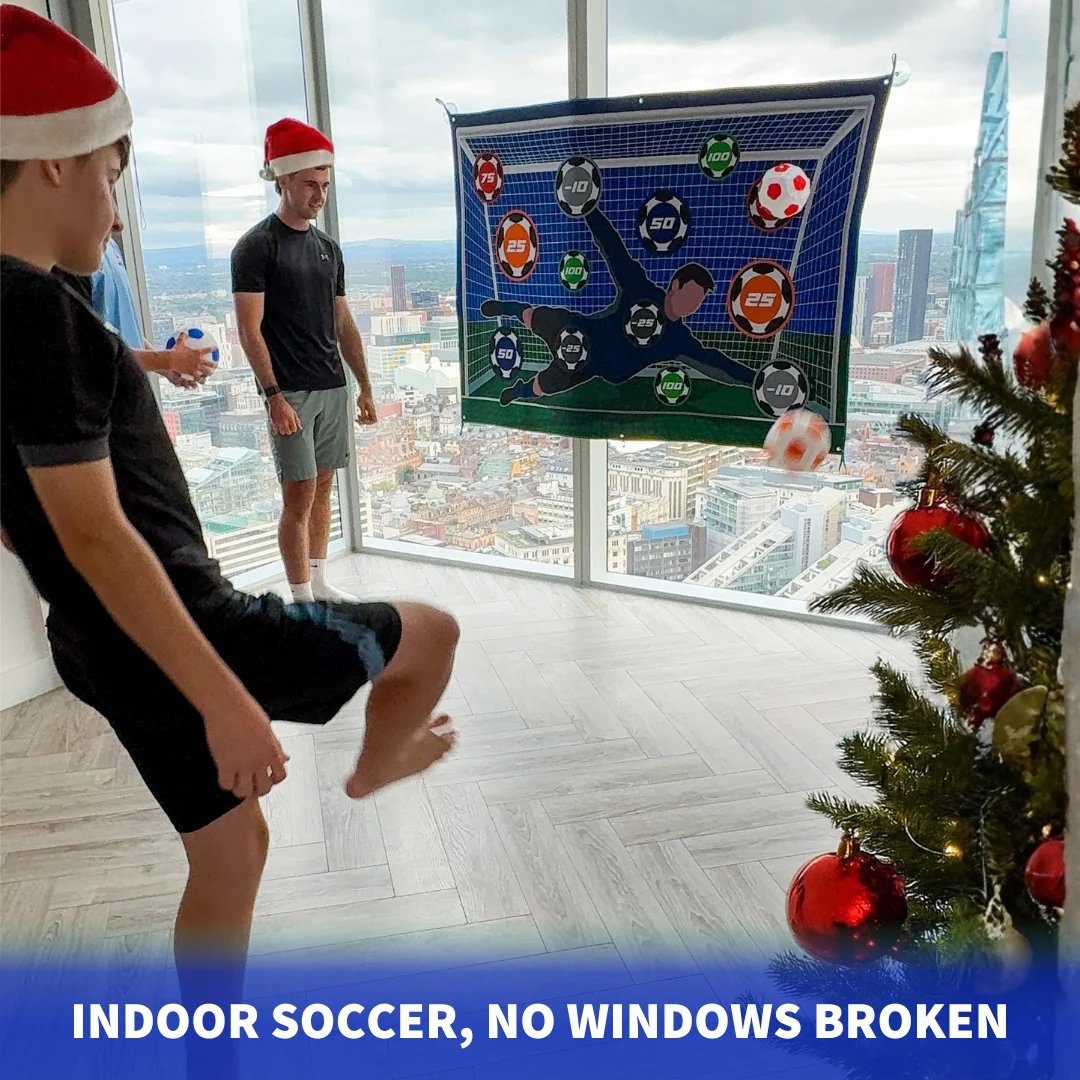 Indoor soccer on a window with the ball stuck to the target