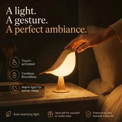 Touch-control bird night light casting a warm bedside glow