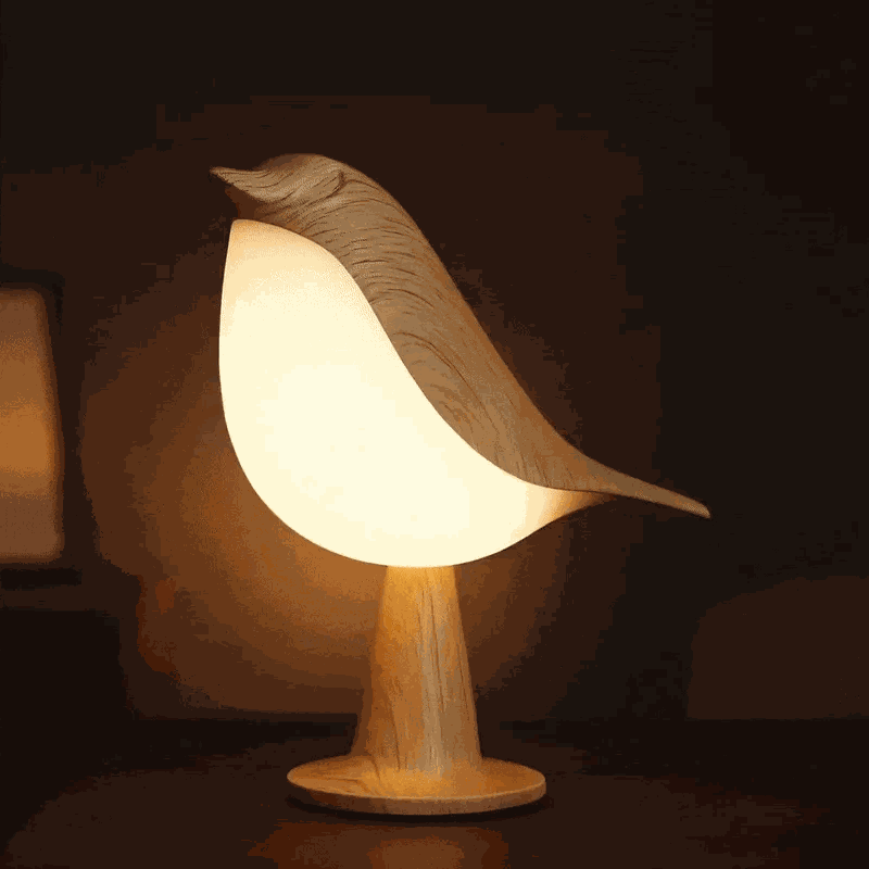 Decorative bird night light with a glowing body and wood-grain appearance