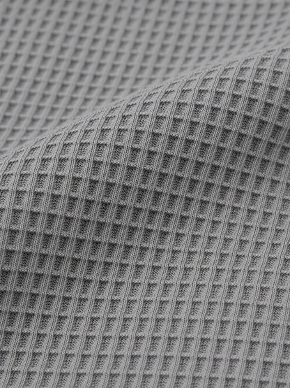 Grey waffle knit fabric close-up