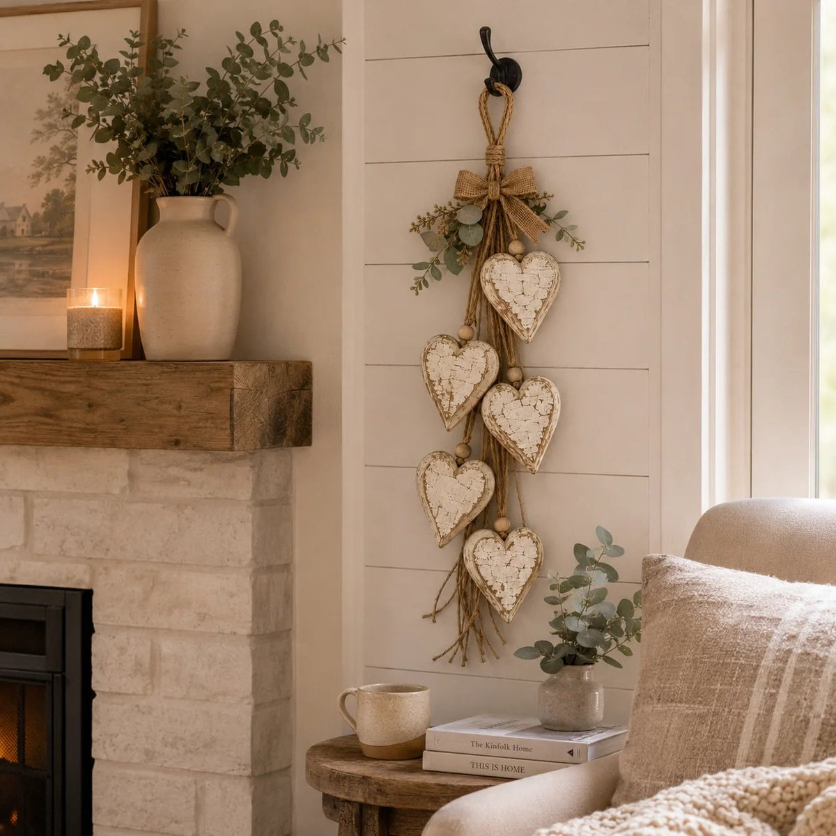 Rustic Neutral hanging heart wall decor in cozy fireplace living room