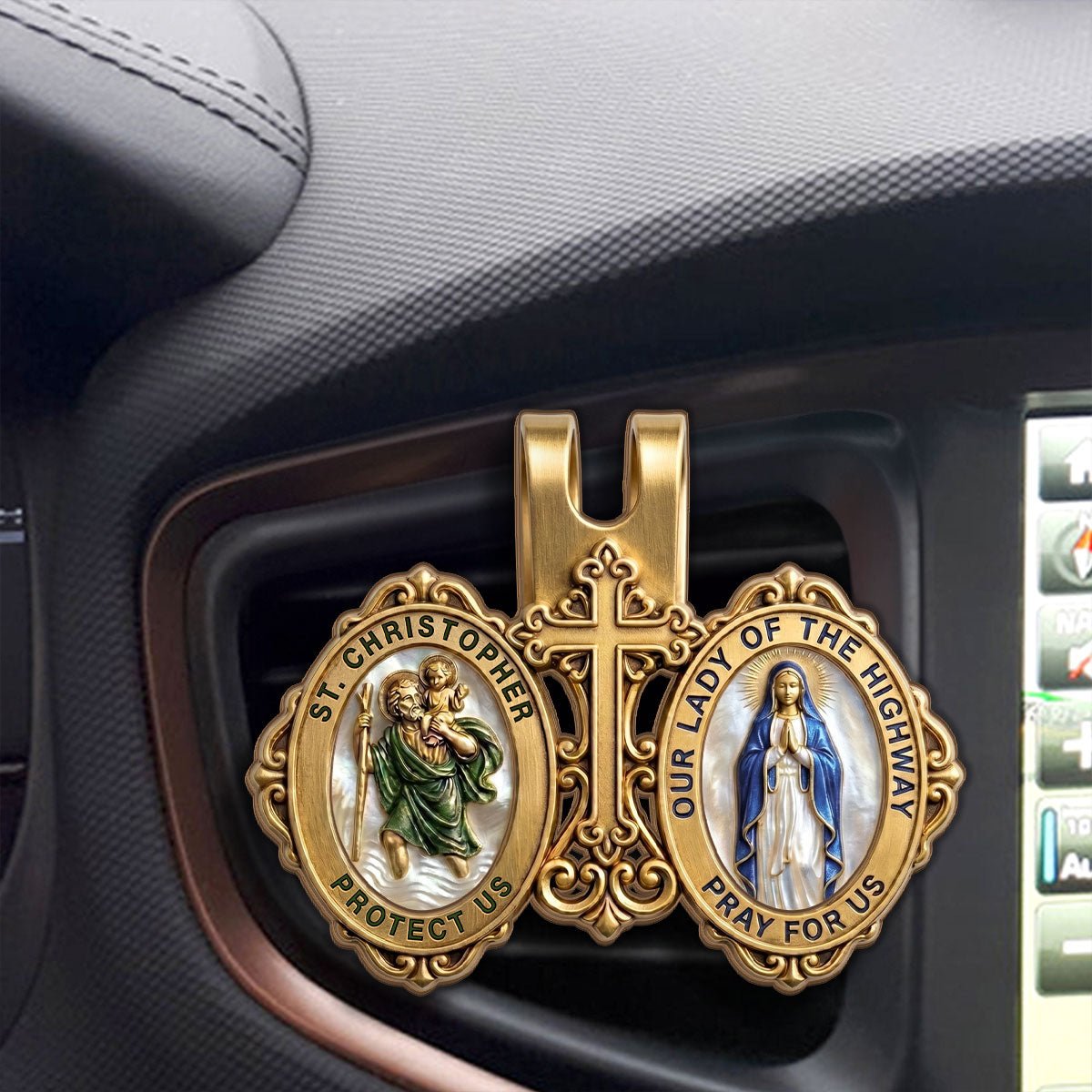 St. Christopher and Mary visor clip displayed inside car interior