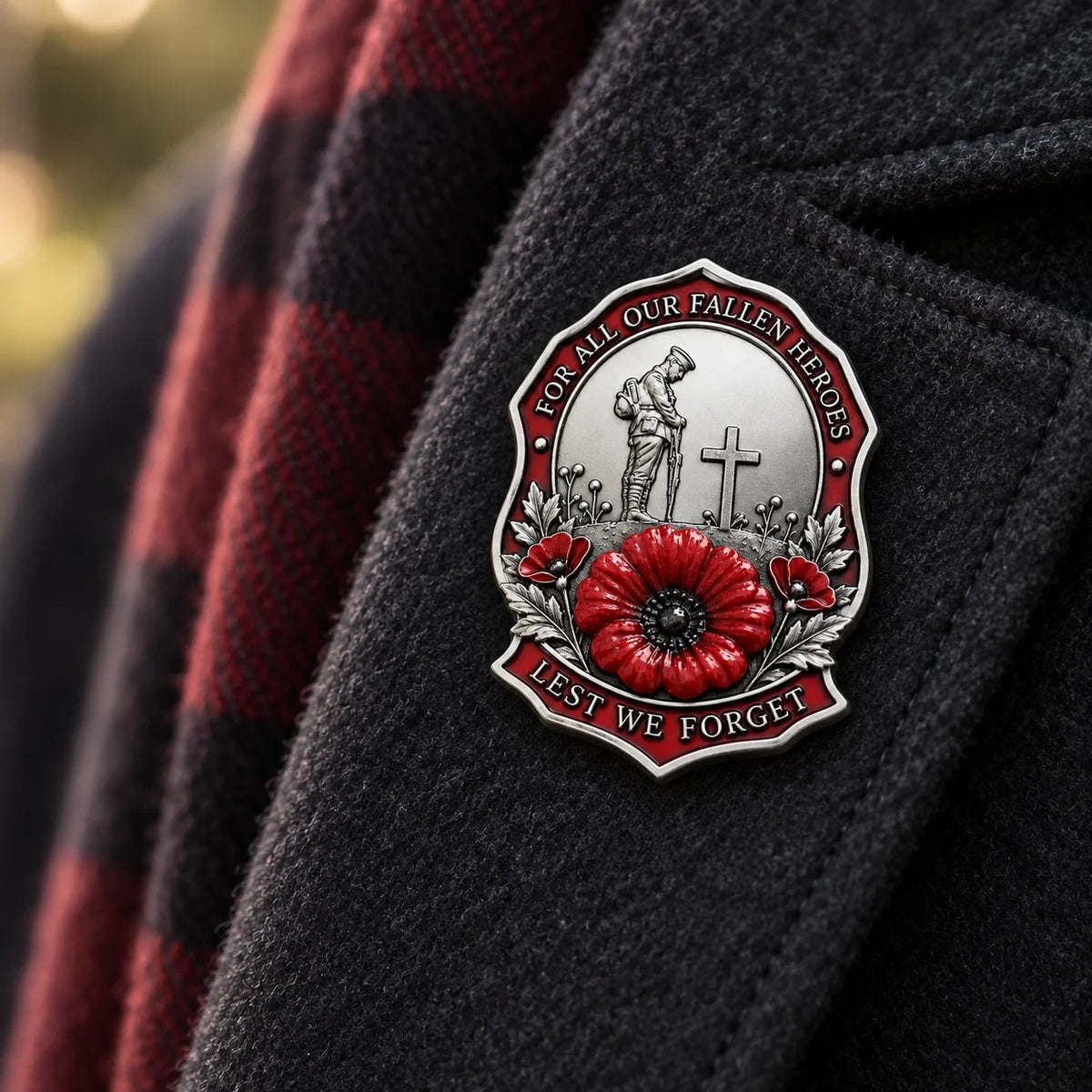 Silver-tone red poppy remembrance brooch styled with a dark coat and scarf