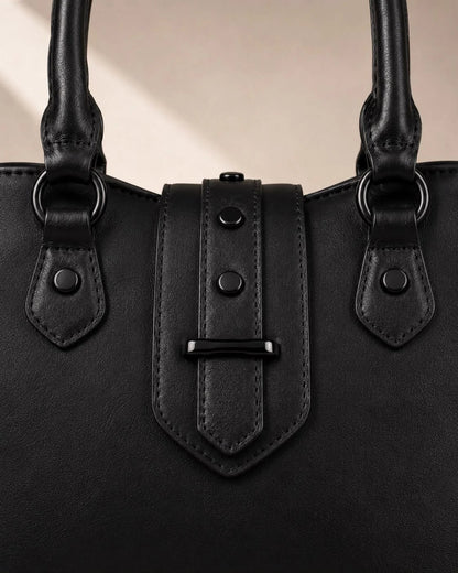 Black batwing tote reinforced handle attachments, rivets and tonal stitching