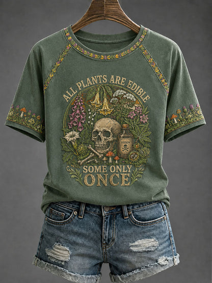 Women's Green raglan tee with vintage botanical skull print, front view